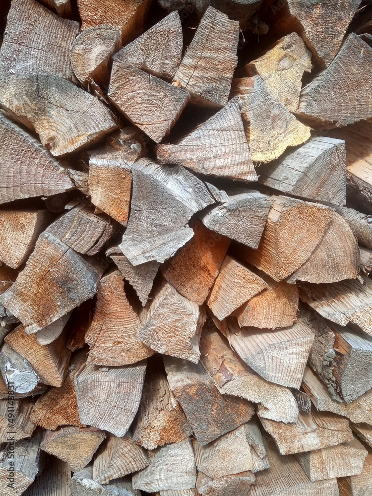 Birch firewood put in woodpile background Birch firewood put in woodpile background