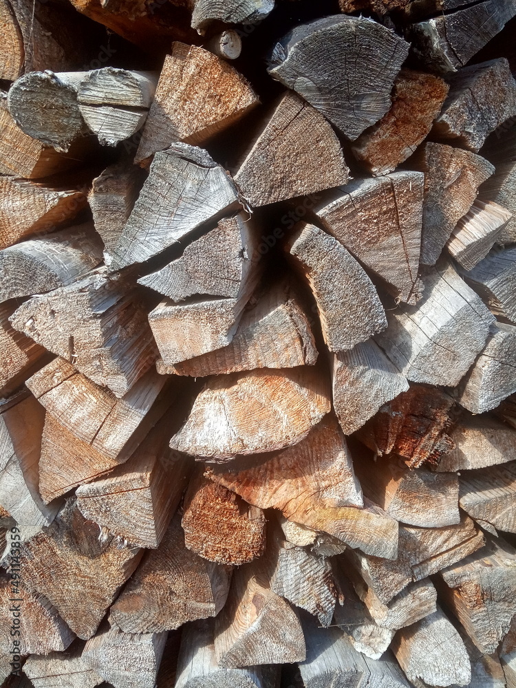 Birch firewood put in woodpile background Birch firewood put in woodpile background