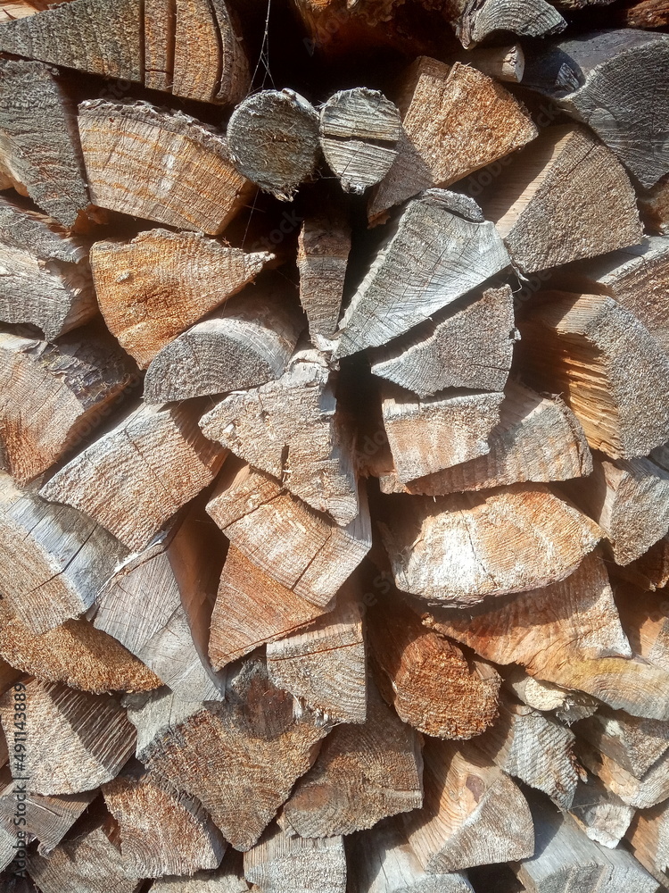 Birch firewood put in woodpile background Birch firewood put in woodpile background