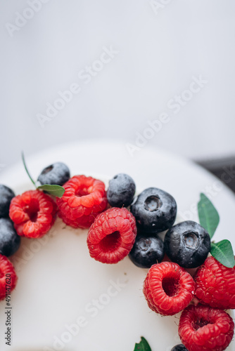 birthday cake with berries. Raspberry and blueberry.