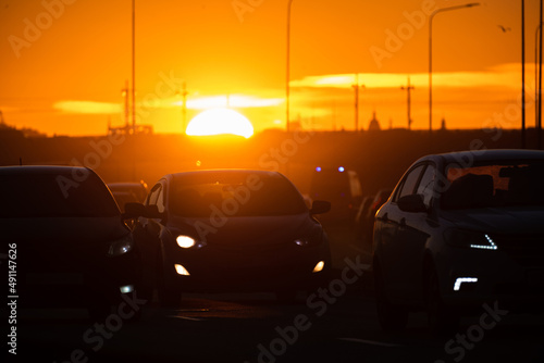 Road with cars at sunset © ivan