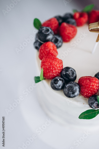 birthday cake with berries. Raspberry and blueberry.
