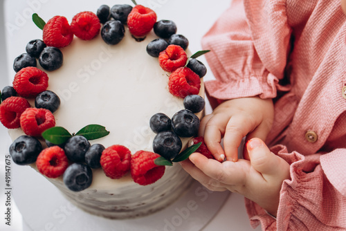 birthday cake with berries. Raspberry and blueberry.