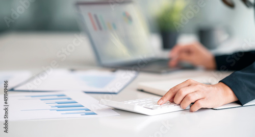 Businesswoman calculating progress of business and analyzing financial and investment data ,business planning and strategy.