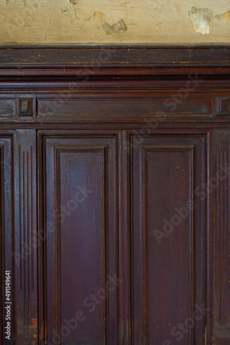 Close up, dark wood wall panel, english panel, wainscot, boiserie panels. Detailed texture