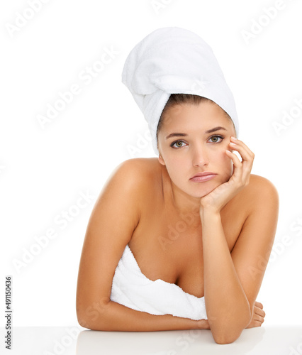 I think I need a new routine. Cropped portrait of a gorgeous young woman looking bored while wrapped in towels against a white background.