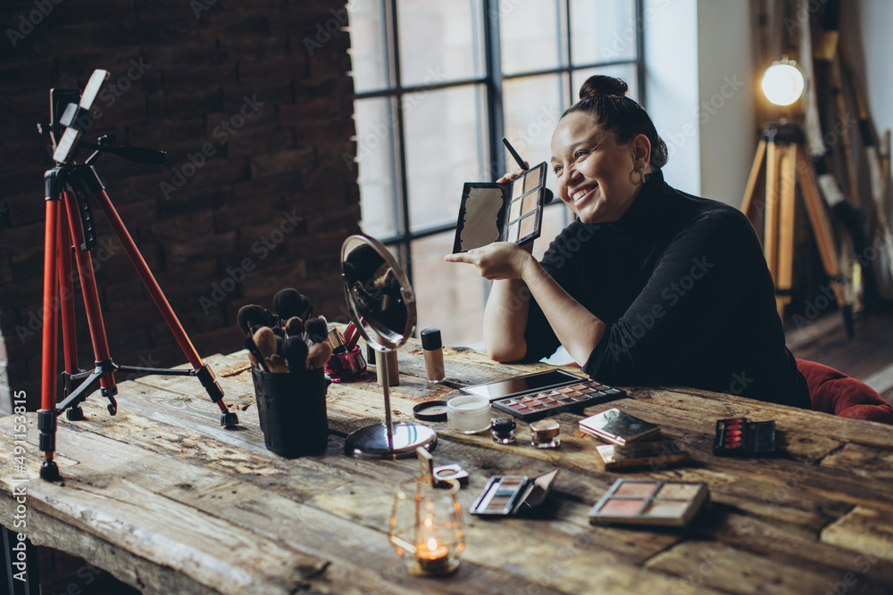 A woman does makeup live. High quality photo A woman does makeup live. High quality photo