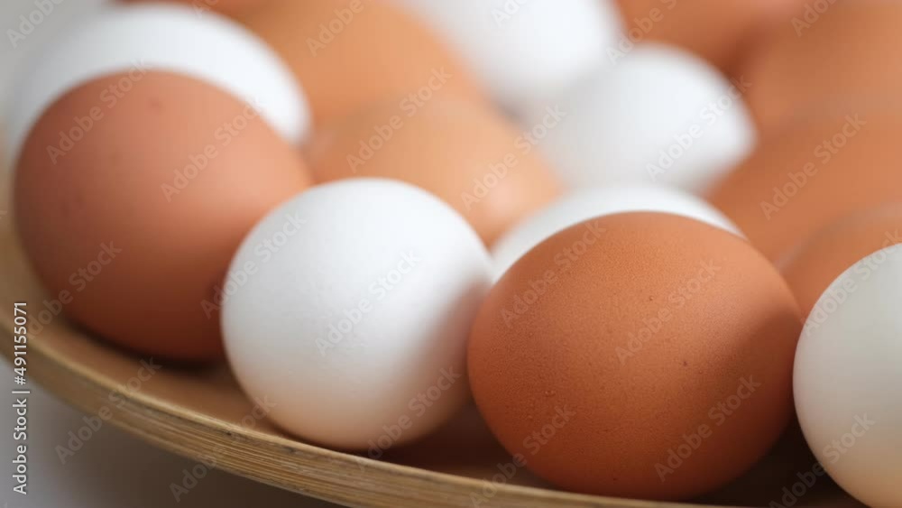 Chicken egg, rotation shot, Chicken fresh raw eggs.Healthy fresh food ingredients for breakfast. Animal products. Grocery. Chicken farm fresh eggs Chicken egg, rotation shot, Chicken fresh raw eggs.Healthy fresh food ingredients for breakfast. Animal products. Grocery. Chicken farm fresh eggs