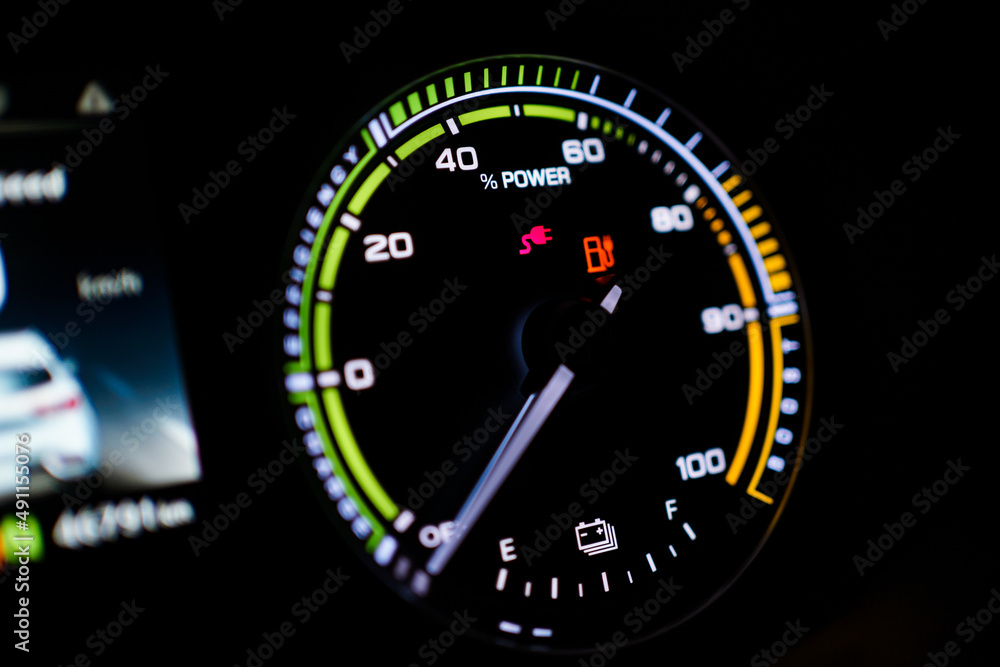 Digital modern dashboard in a electric vehicle - EV while charging at the charging station. Digital modern dashboard in a electric vehicle - EV while charging at the charging station.