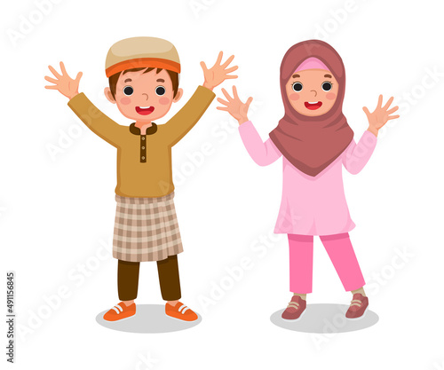 cute little muslim islamic kids boy and girl waving hands showing welcoming greeting celebrating Ramadhan