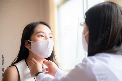 health insurance concept, young Asian woman professional doctor are checking her patient in hospital, medical heal care consultation