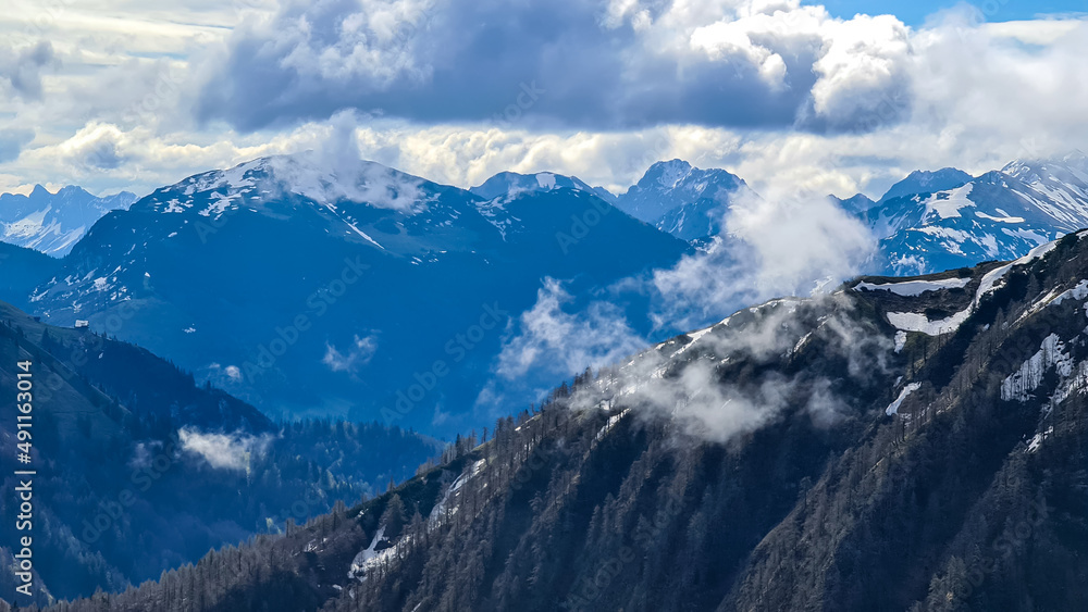 Panoramic view near Frauenkogel on the mountain peaks covered in clouds in the Karawanks, Carinthia, Austria. Borders with Slovenia. Triglav National Park. Looking on mount Hochstuhl( Stol). Freedom Panoramic view near Frauenkogel on the mountain peaks covered in clouds in the Karawanks, Carinthia, Austria. Borders with Slovenia. Triglav National Park. Looking on mount Hochstuhl( Stol). Freedom