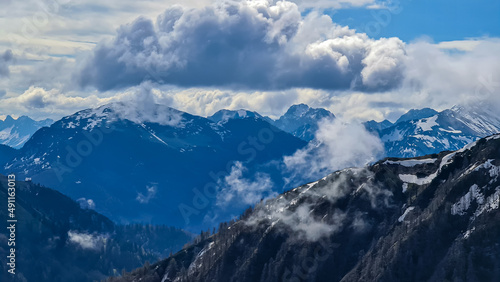 Panoramic view near Frauenkogel on the mountain peaks covered in clouds in the Karawanks, Carinthia, Austria. Borders with Slovenia. Triglav National Park. Looking on mount Hochstuhl( Stol). Freedom