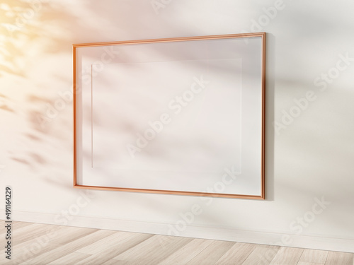 Fototapeta Naklejka Na Ścianę i Meble -  Golden frame hanging in bright interior mockup. Template of a picture framed on a wall 3D rendering
