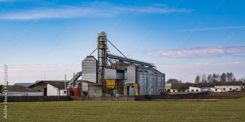 agro silos granary elevator. Silos on agro-processing manufacturing plant for processing drying cleaning and storage of agricultural products, flour, cereals and grain. agro silos granary elevator. Silos on agro-processing manufacturing plant for processing drying cleaning and storage of agricultural products, flour, cereals and grain.