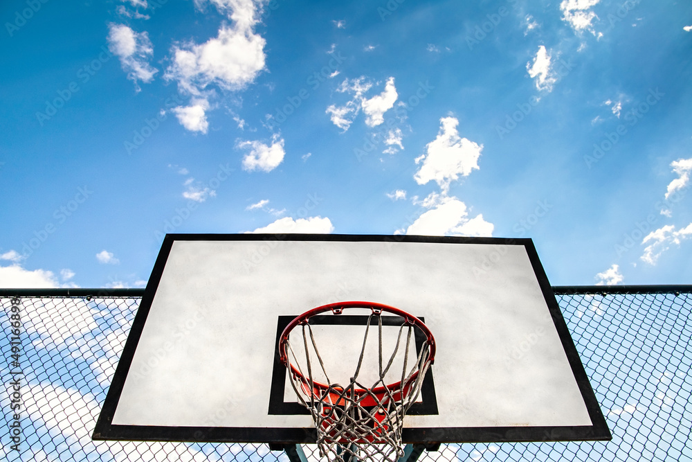 Streetball hoop outdoor. Blue sky as background and copy space. Urban youth game