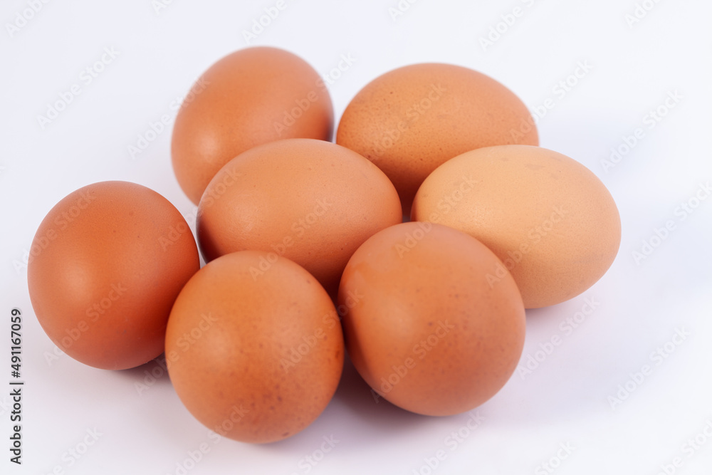 seven eggs are placed on a white background with free space on right seven eggs are placed on a white background with free space on right