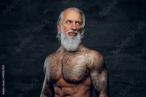 Fitnes grandfather bodybuilder with long beard and naked torso © Fxquadro