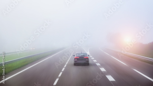 a car on the freeway in the heavy fog