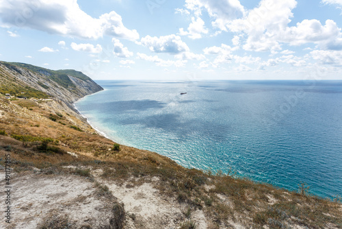 Beautiful landscape of high coast, blue sea and fluffy clouds on a sunny summer day. The Black Sea coast. Anapa © яна винникова