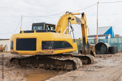 Heavy excavators at a construction site. Construction equipment for earthworks. Quarry excavator. Improvement of the territory and earthworks.