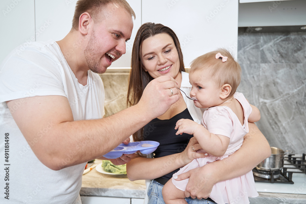 Happy positive family photo while enjoying their time together at home Happy positive family photo while enjoying their time together at home