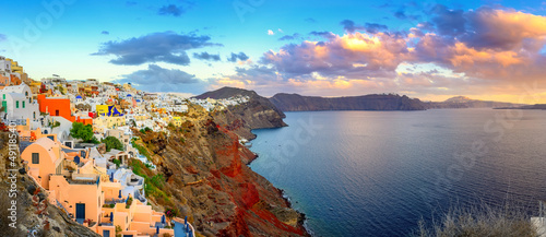 Picturesque sunset on famous view resort over Oia town on Santorini island, Greece, Europe. famous travel landscape. Summer holidays. Travel concept background.