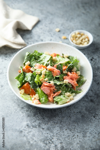 Traditional Caesar salad with salmon