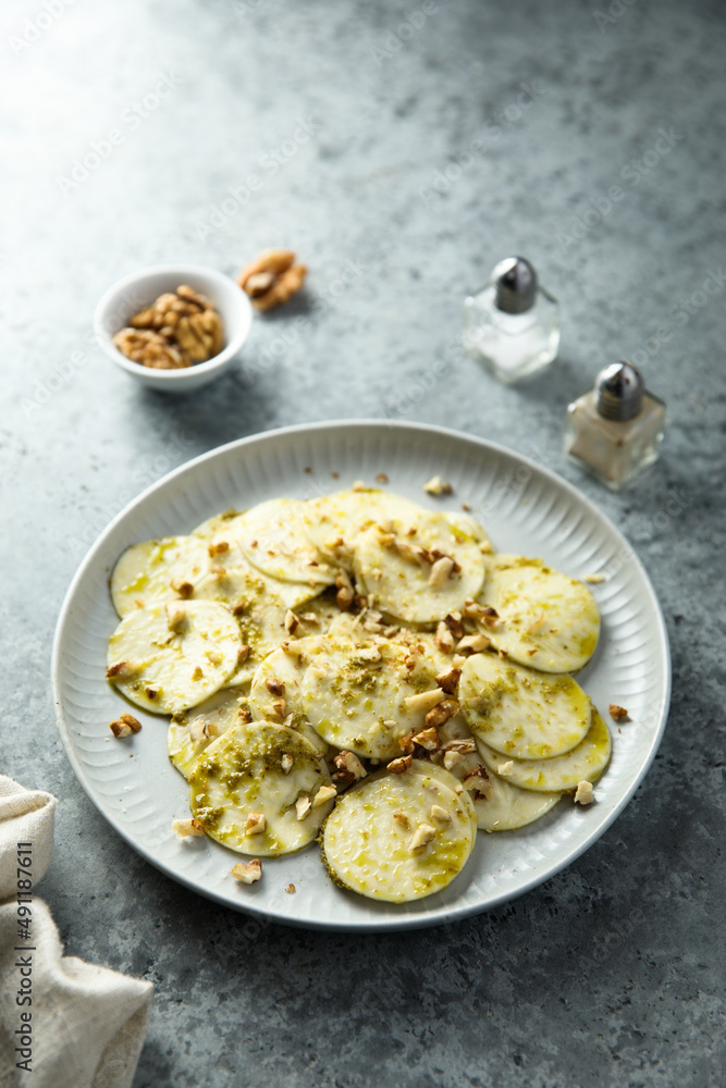 Courgette carpaccio with walnut and olive oil