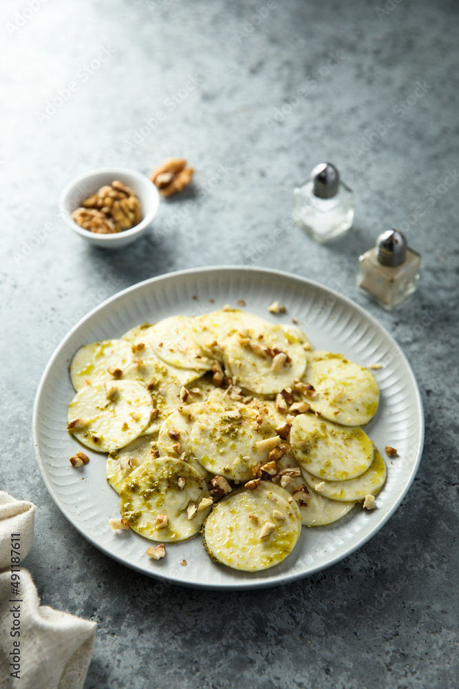 Courgette carpaccio with walnut and olive oil Courgette carpaccio with walnut and olive oil