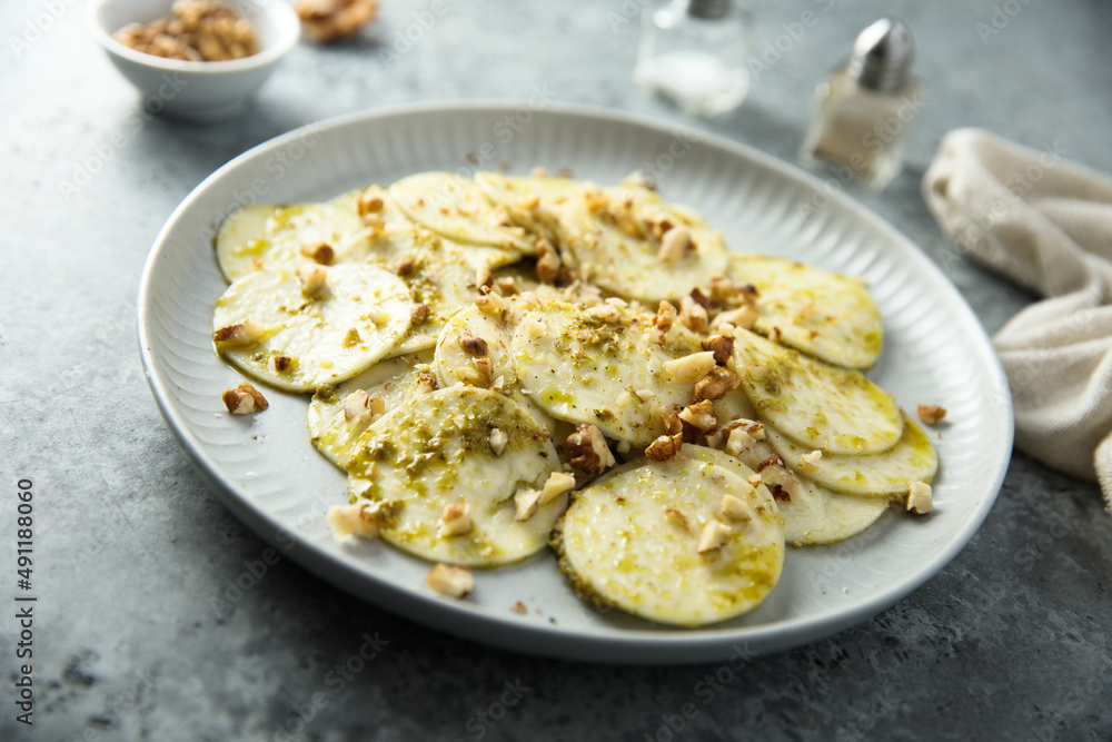 Courgette carpaccio with walnut and olive oil Courgette carpaccio with walnut and olive oil