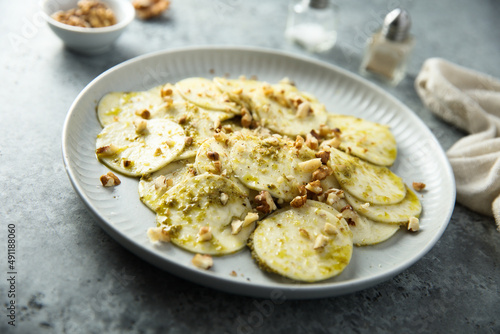 Courgette carpaccio with walnut and olive oil