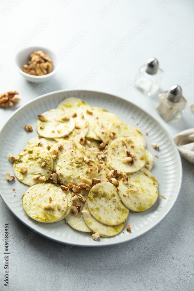 Courgette carpaccio with walnut and olive oil