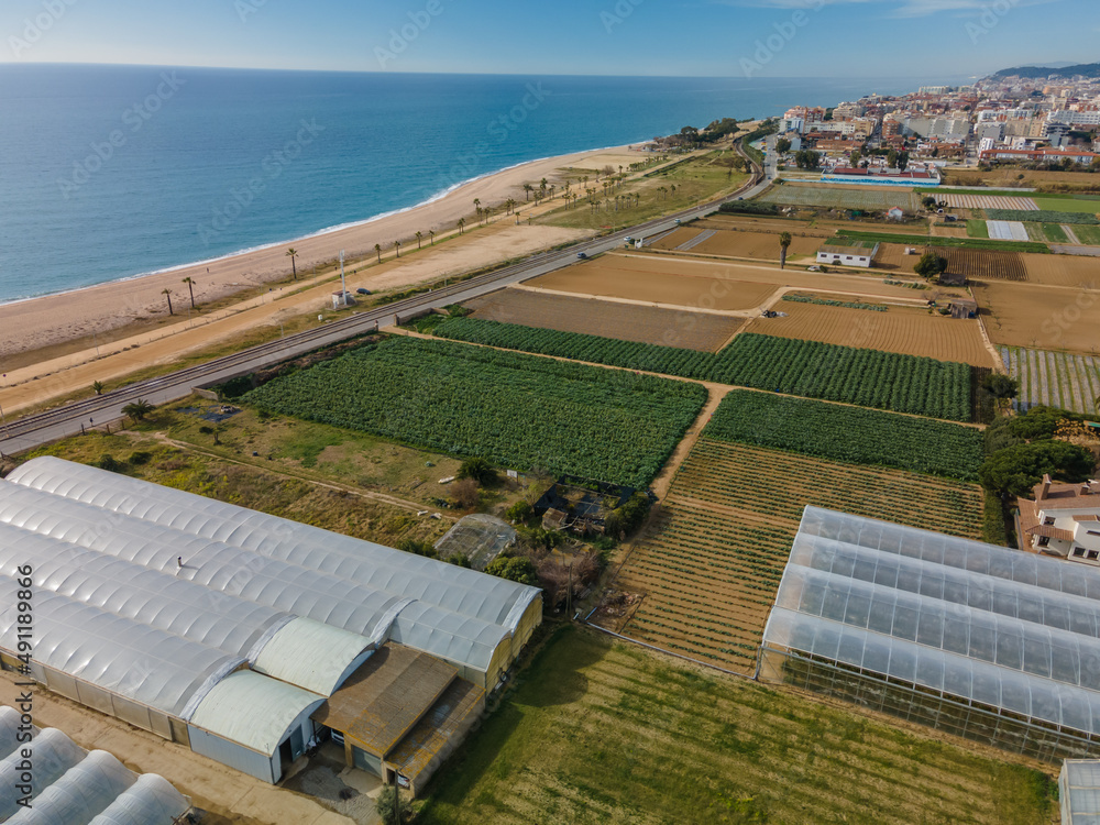 Fototapeta premium Aerial images of the beach of Malgrat de Mar in the Maresme Costa Brava pine forest without people drone