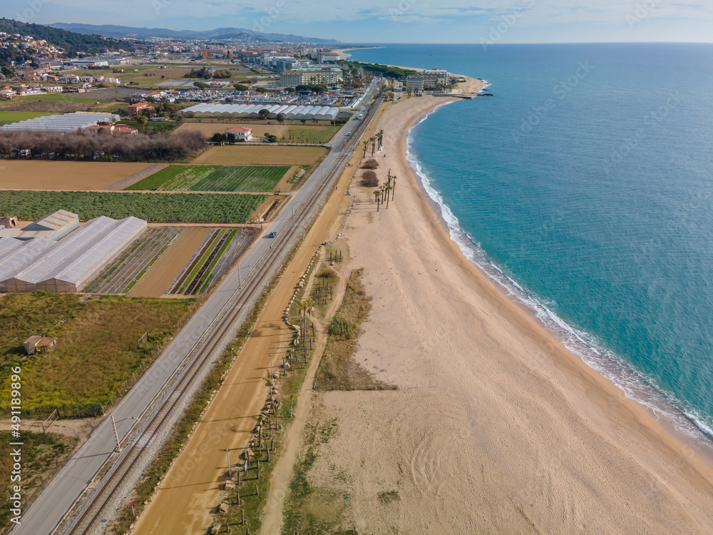 Aerial images of the beach of Malgrat de Mar in the Maresme Costa Brava pine forest without people drone