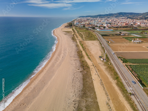 Aerial images of the beach of Malgrat de Mar in the Maresme Costa Brava pine forest without people drone photo