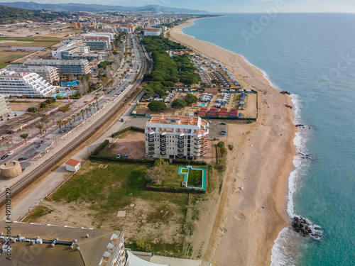 Aerial images of the beach of Malgrat de Mar in the Maresme Costa Brava pine forest without people drone photo