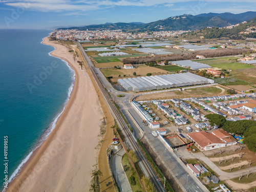 Aerial images of the beach of Malgrat de Mar in the Maresme Costa Brava pine forest without people drone photo