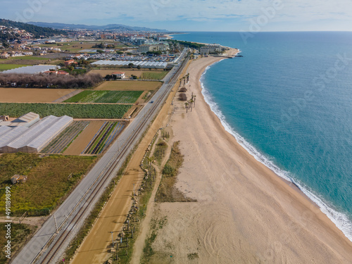 Aerial images of the beach of Malgrat de Mar in the Maresme Costa Brava pine forest without people drone © Osvaldo Mussi