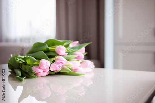 Bouquet on the bed in bedroom