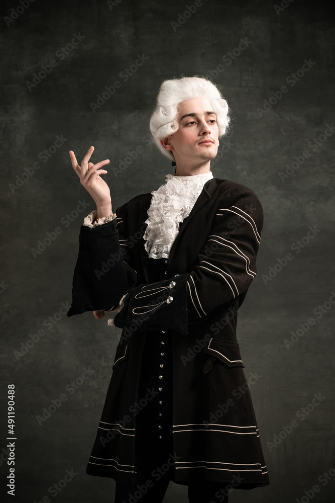 Ταπετσαρία Young man in image of Amadeus Mozart, medieval person isolated on dark green vintage background