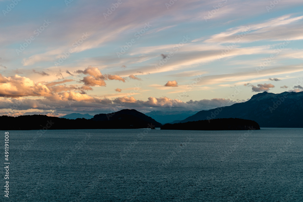 Fototapeta premium sunset over the mountains and lake