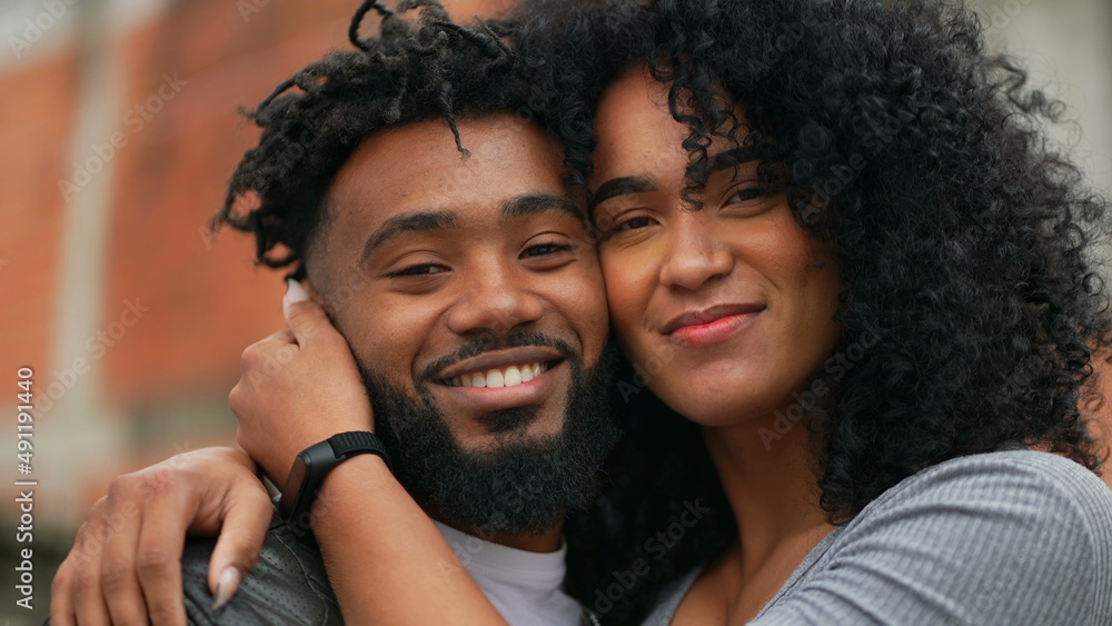 A couple posing for camera a hispanic latin black couple A couple posing for camera a hispanic latin black couple