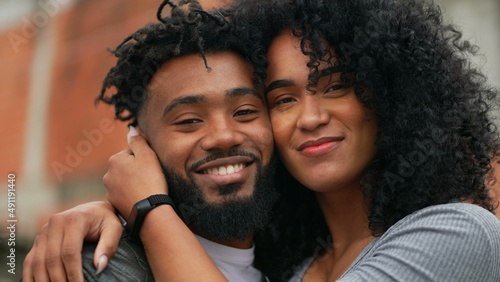 A couple posing for camera a hispanic latin black couple