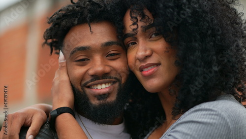 A couple posing for camera a hispanic latin black couple