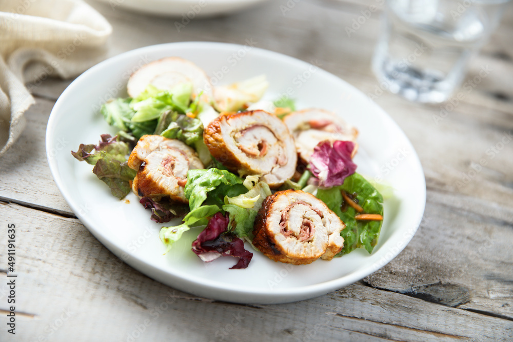 Homemade chicken roulade with salad
