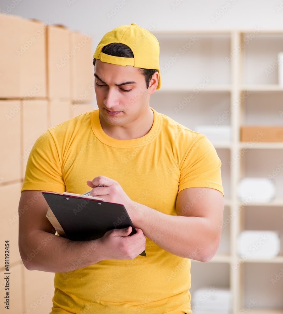 Man working in postal parcel delivery service office Man working in postal parcel delivery service office