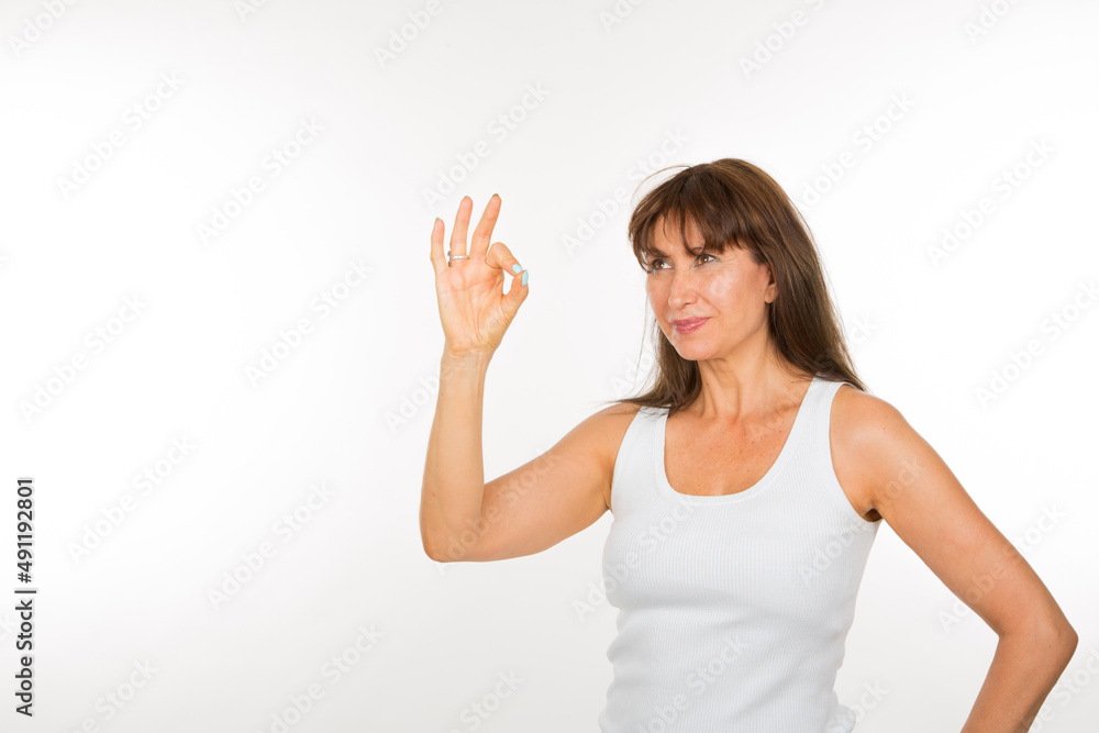 senior woman with okey gesture on white background senior woman with okey gesture on white background