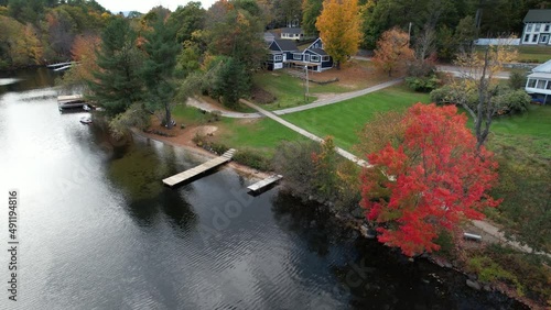 Aerial View of Picturesque Colorful Lakefront, Houses, Autumn Leaf Colors, Docks and Cal Water of Crescent Lake, Wolfeboro, New Hampshire USA photo