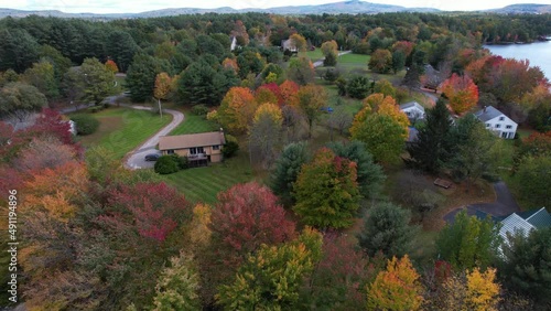 Drone Aerial View of Lakeside Homes, Colorful Trees and Landscape by Crescent Lake, Wolfeboro, New Hampshire USA photo